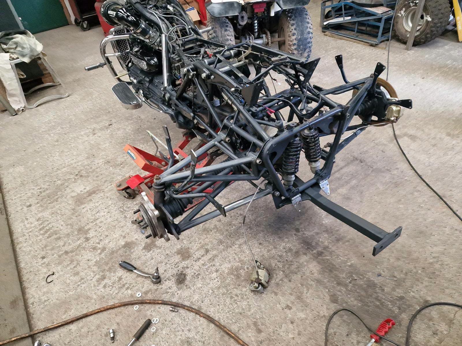 Custom trike frame stripped down in the workshop