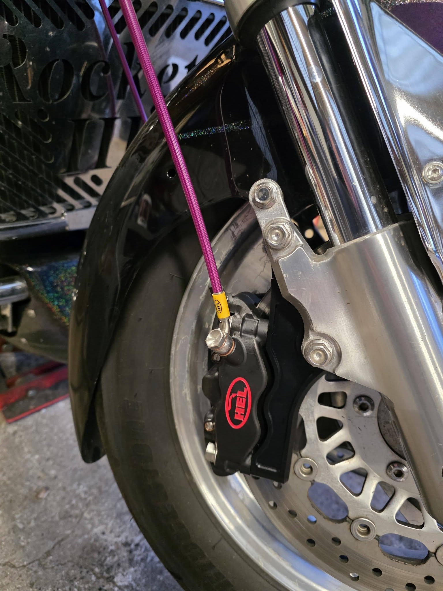 HEL Performance brake caliper and braided line fitted to a motorcycle